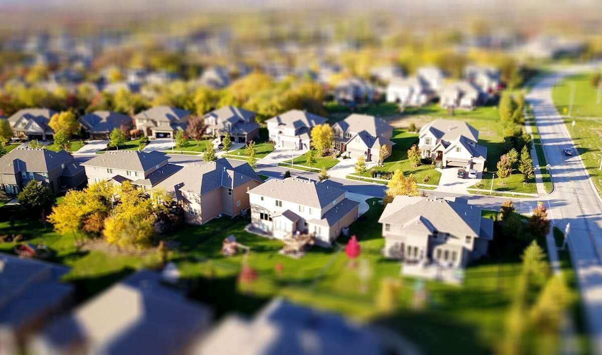 Aerial view of a neighborhood with houses and trees.